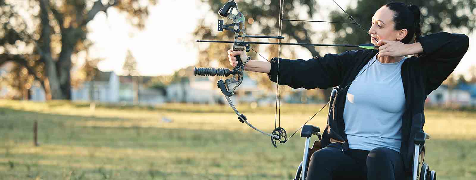 Female paralympic athlete taking part in archery